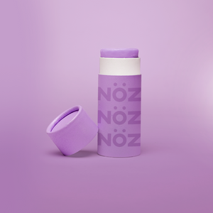 Stick of purple noz sunscreen without cap